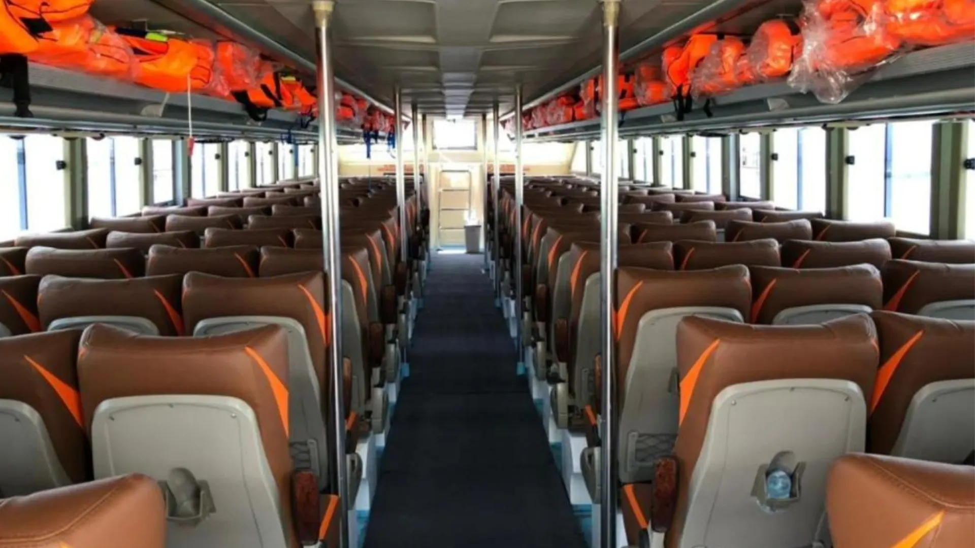Interior of Dcamel Fast Boat with comfortable padded passenger seats rear view cabin