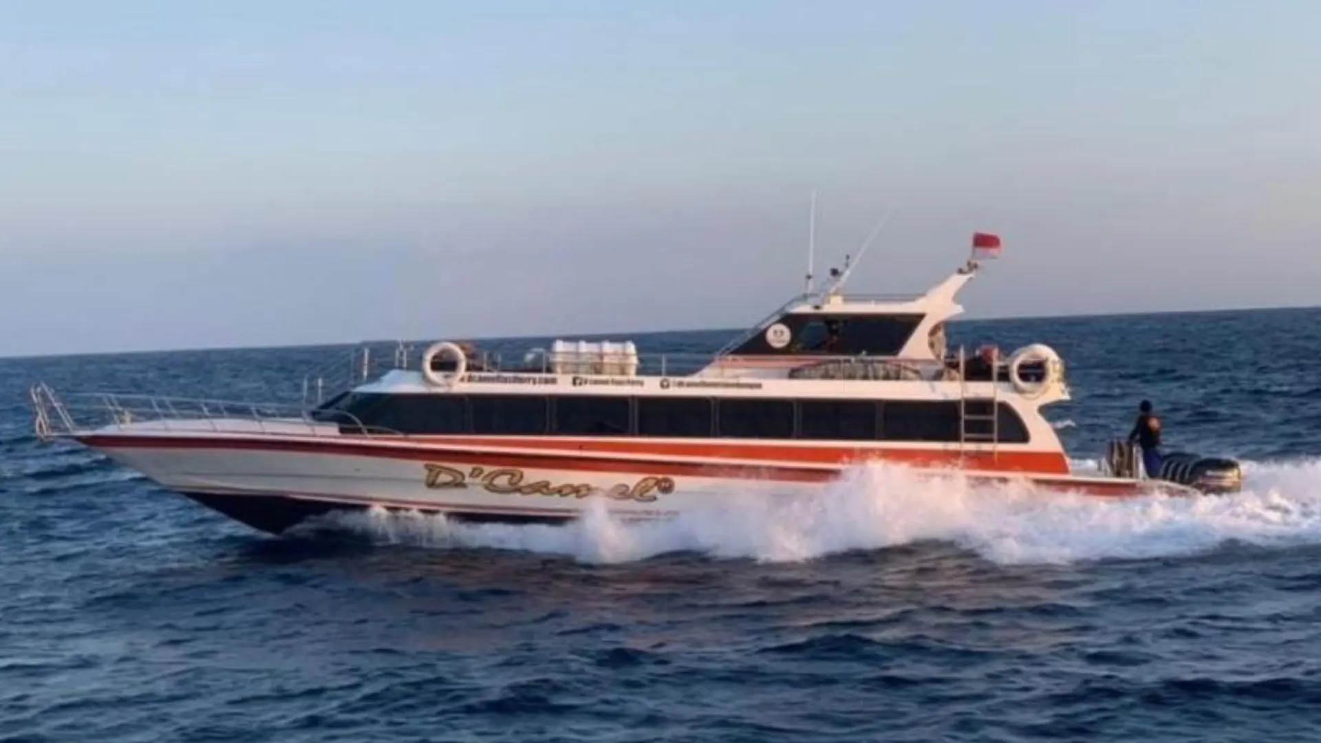 Dcamel Fast Boat cruising at high speed across the ocean on Bali to Lembongan route