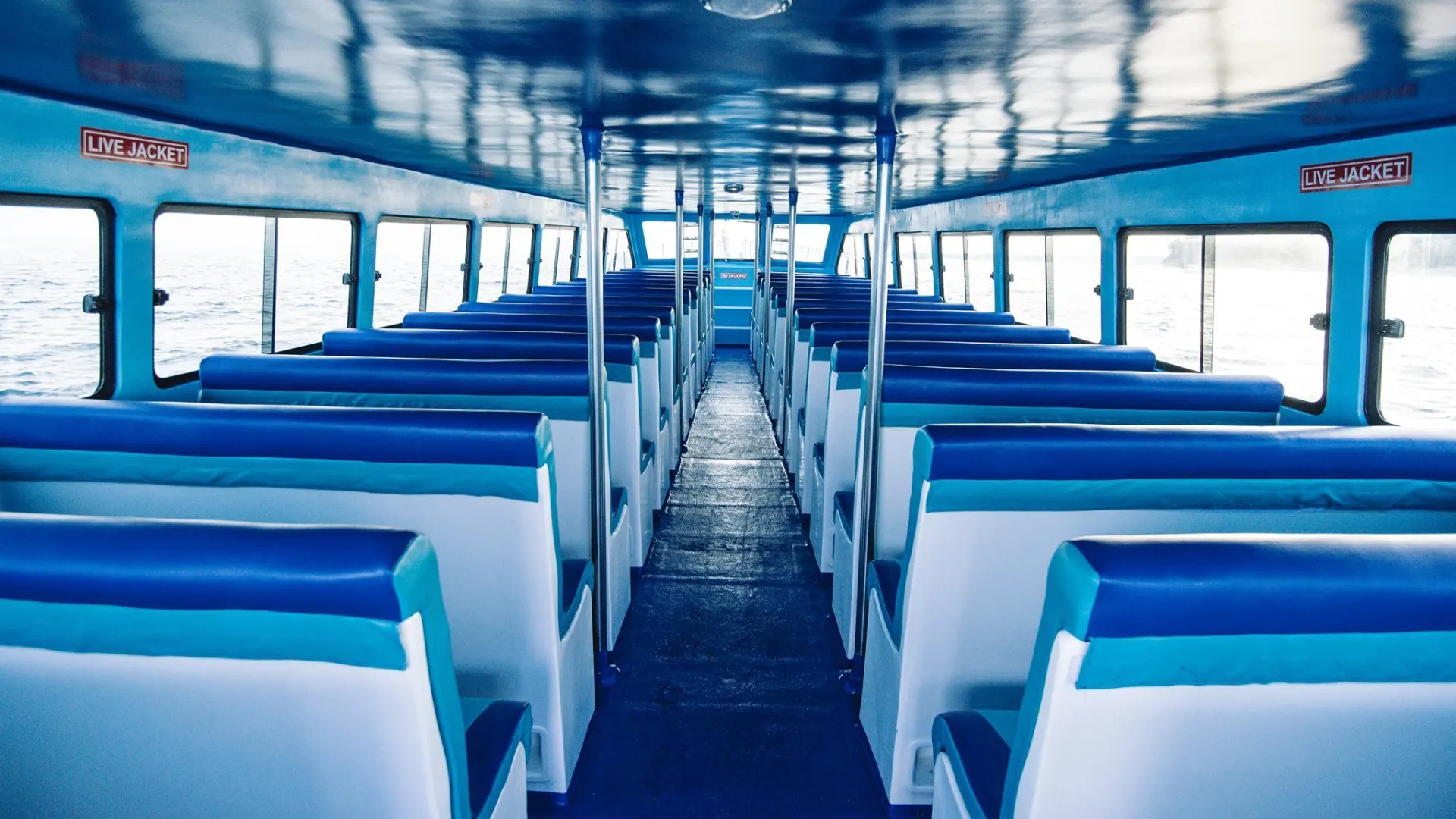Interior of Dream Beach Fast Boat featuring simple and comfortable passenger seating