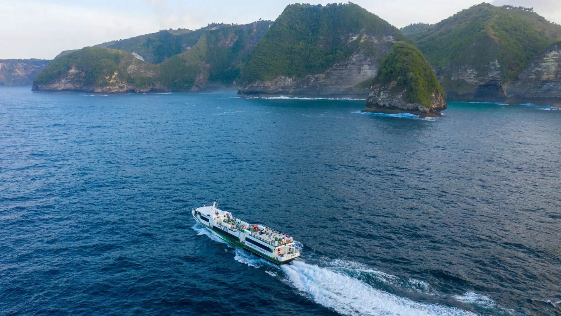 Eka Jaya Fast Ferry traveling across the ocean rear view on Lembongan to Gili Island fast boat journey