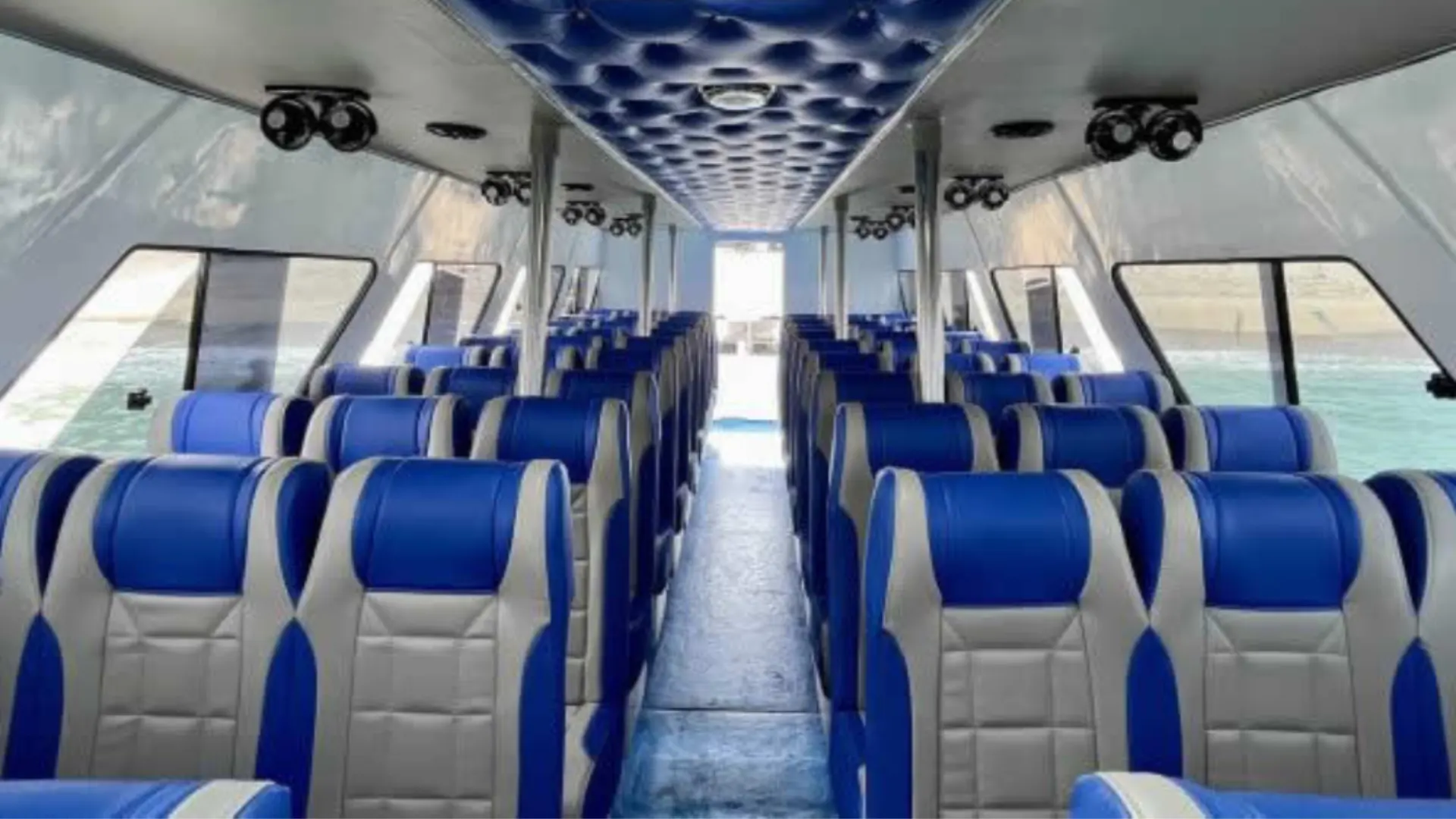 Interior of The Tanis Fast Cruise fast boat with comfortable padded seats view from front cabin