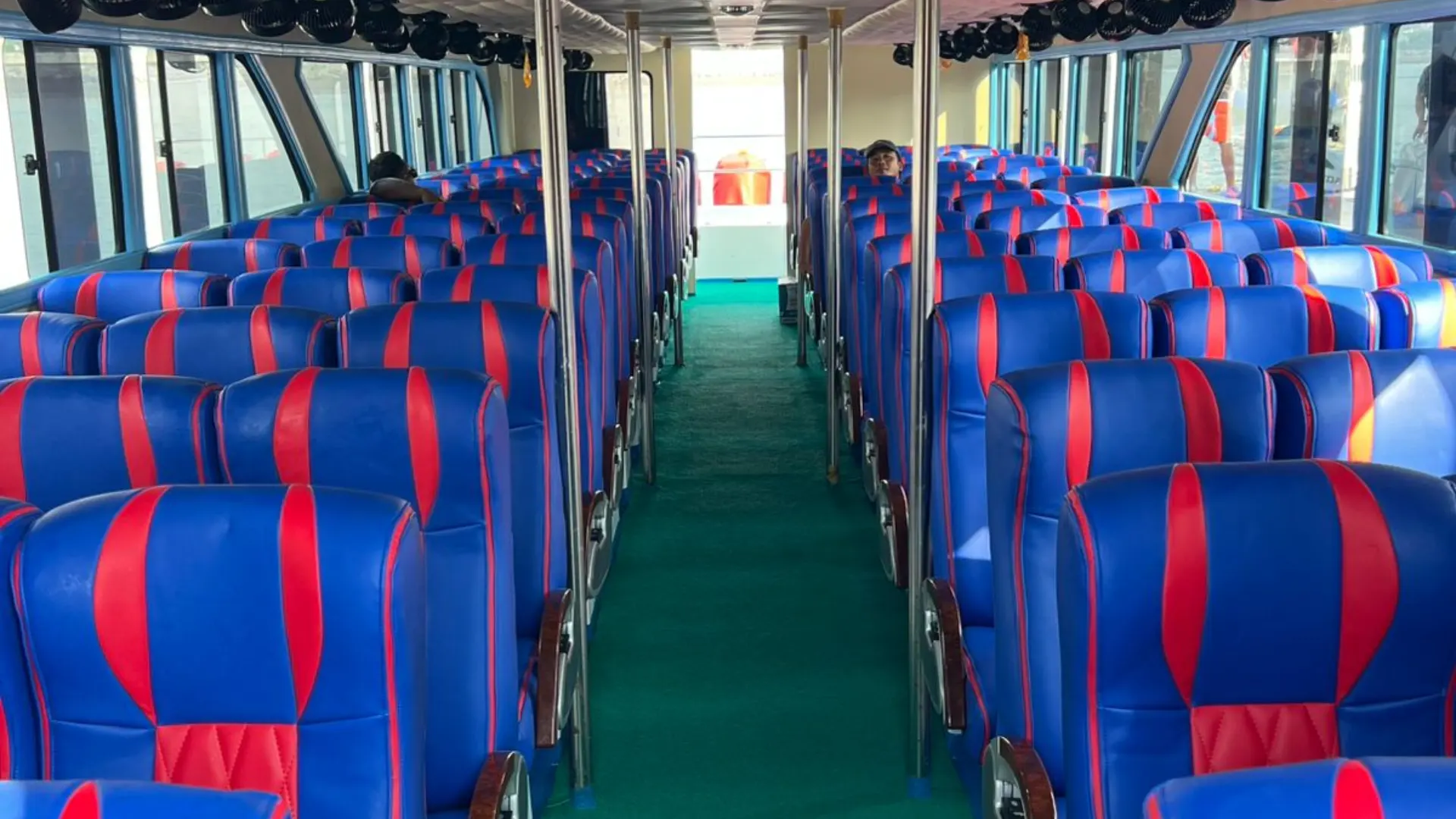 Interior of Wijaya Buyuk Fast Boat featuring comfortable passenger seating for Lembongan fast boat trip