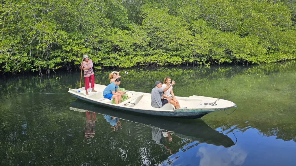 Visitors preparing for a guided tour at Mangrove Forest Nusa Lembongan surrounded by lush mangrove trees