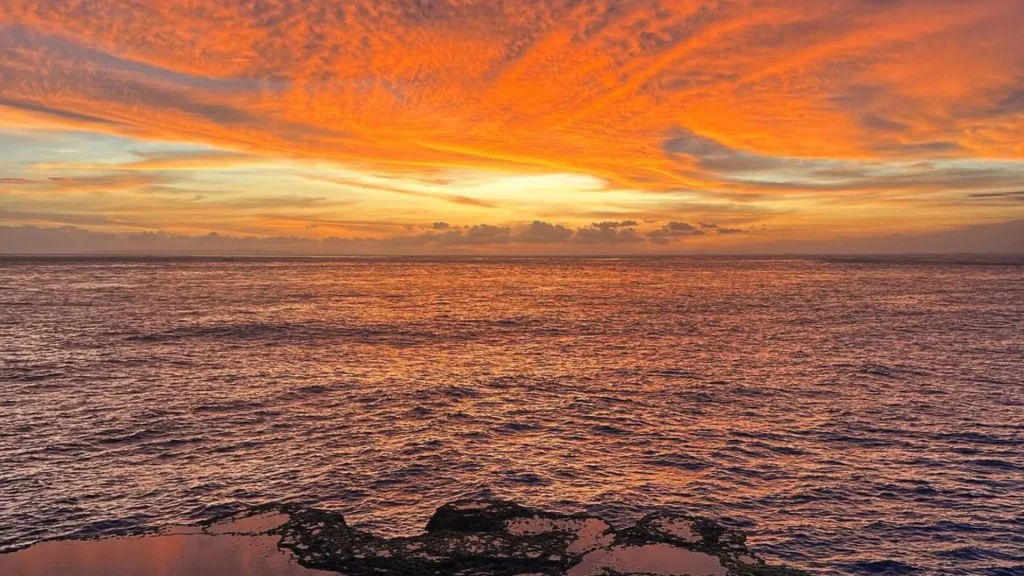 Golden sunset sky over Lembongan Beach during Take Sunset Point Lembongan Tour experience